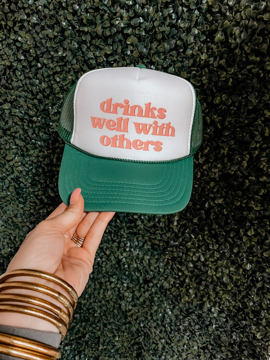 Drinks Well With Others Trucker Hat